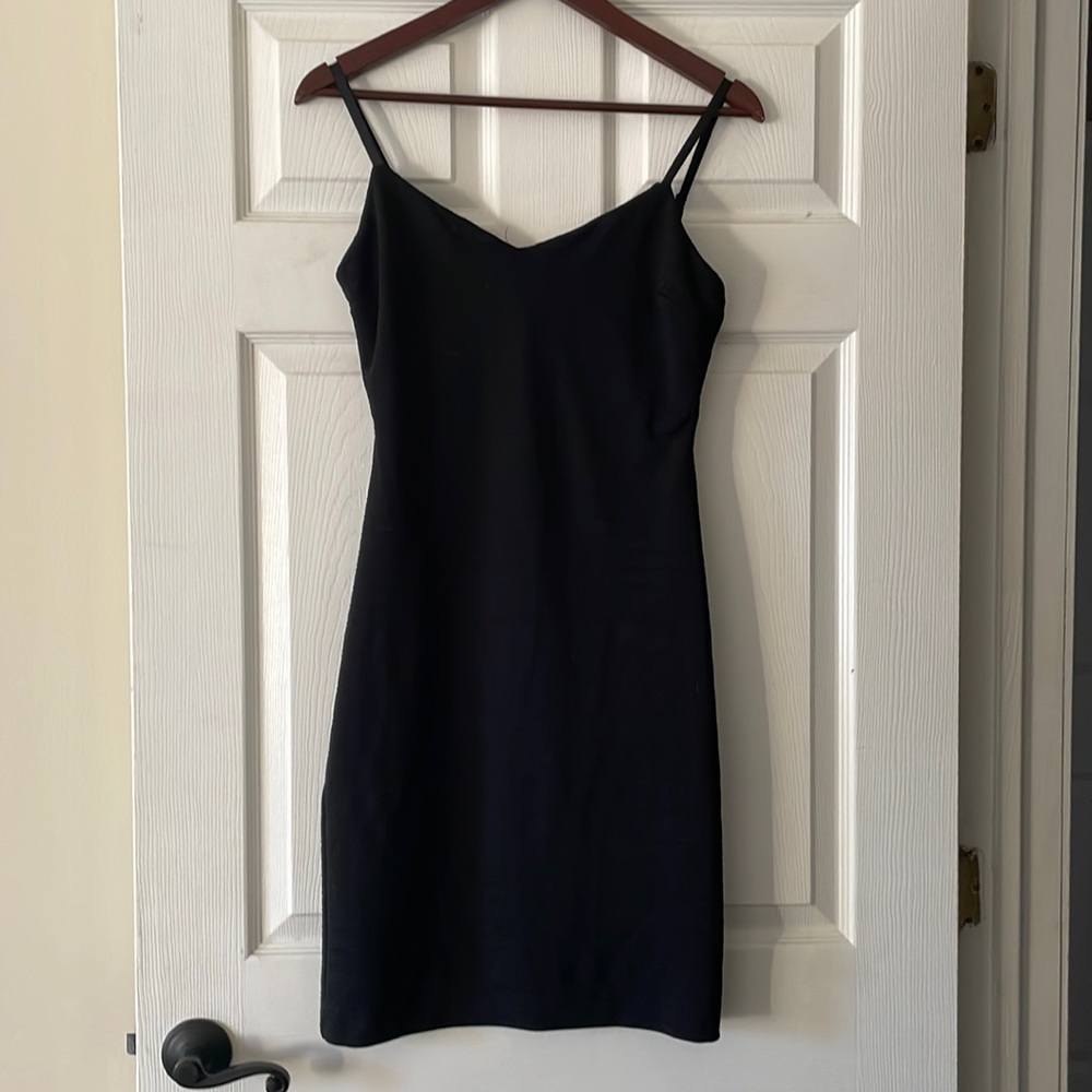 Short low cut black dress with stripe design